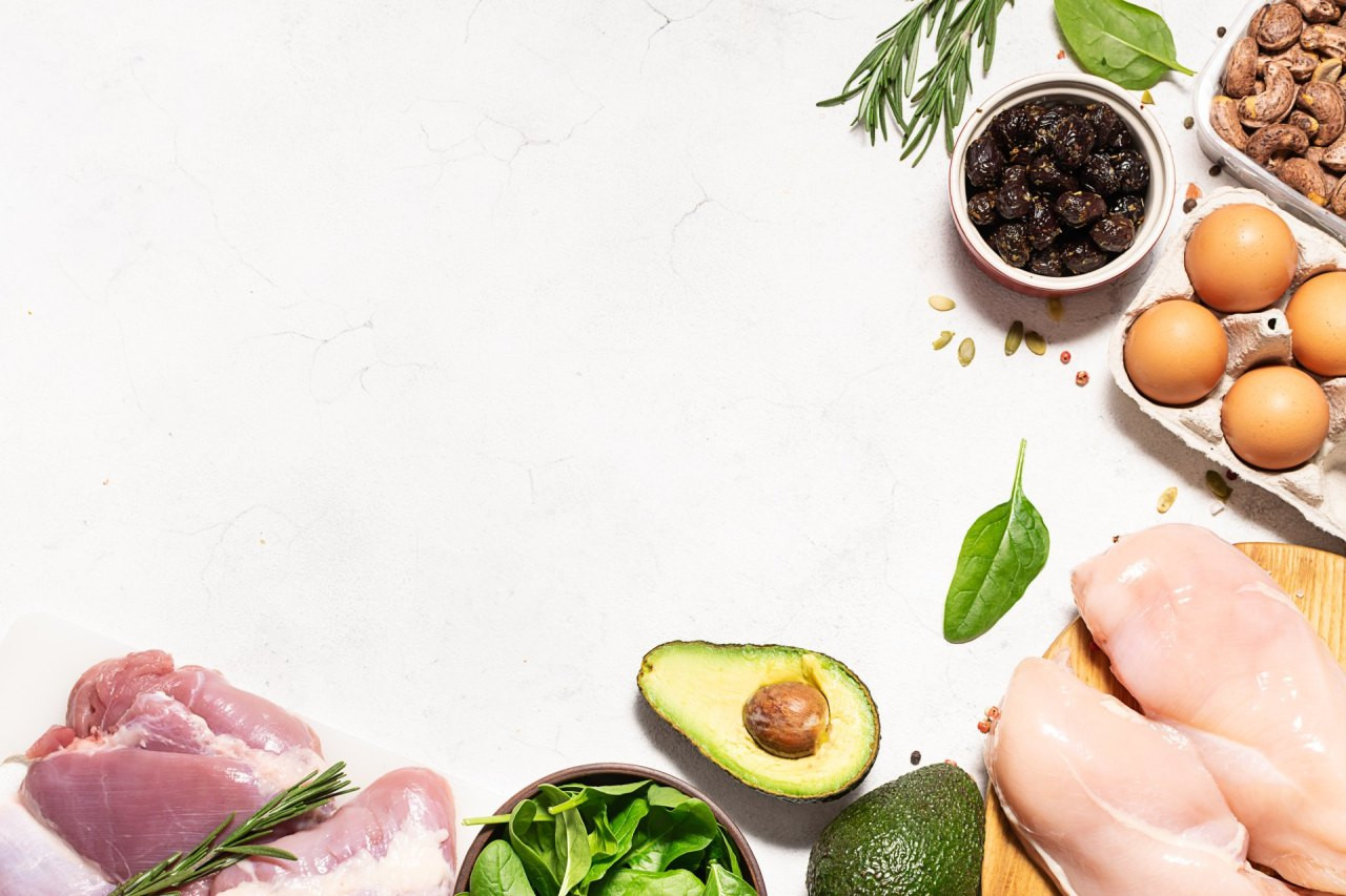 Fresh organic food for low carb keto diet on white marble background long banner format, copy space for your design. Healthy lifestyle and weight loss concept.