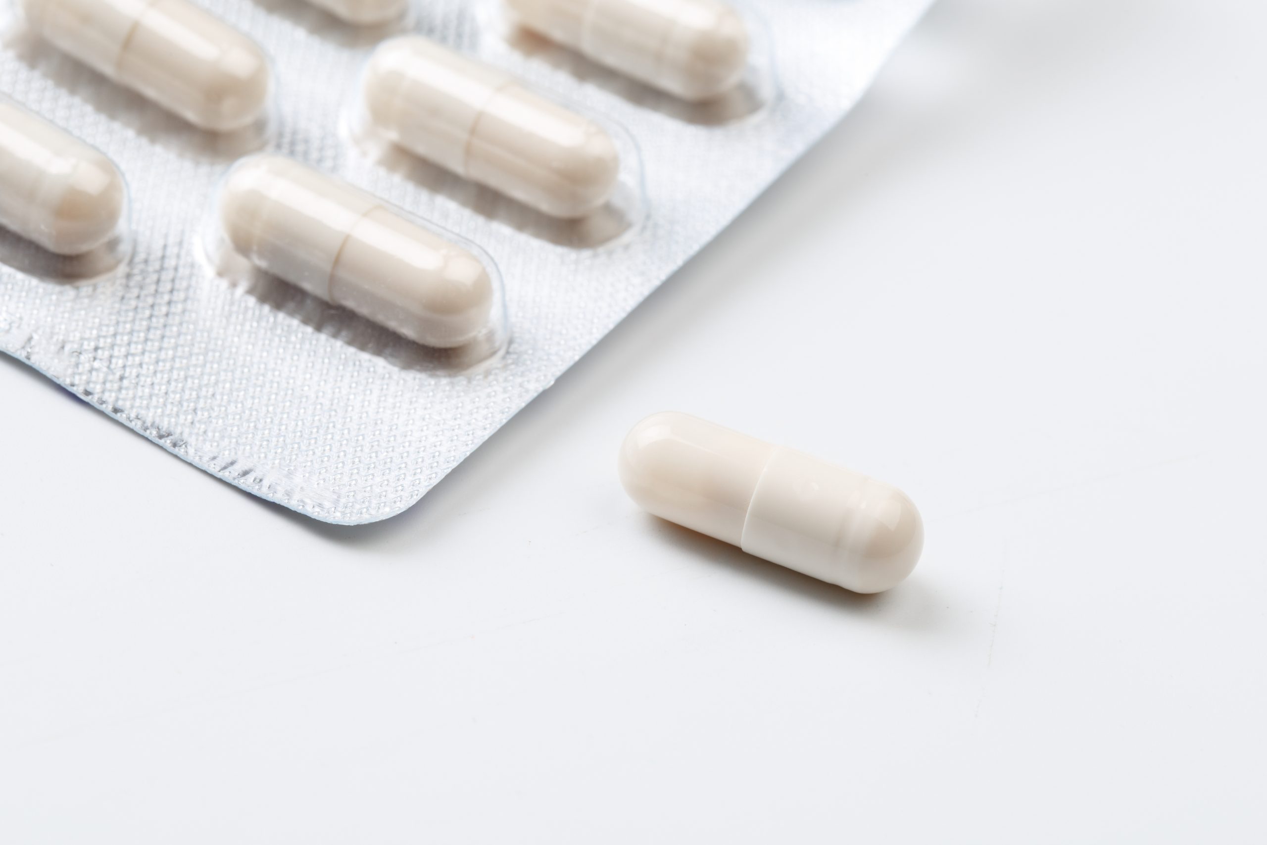 Pile of white capsules