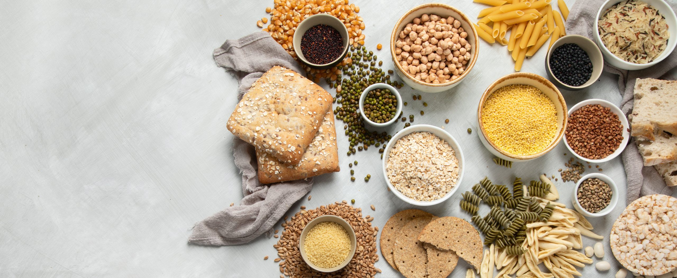 Best sources of carbs on light gray background. Healthy food concept.